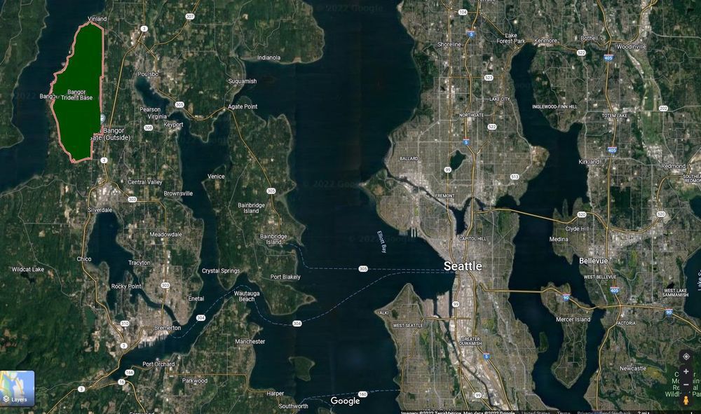 An overhead color satellite photograph showing the location of Bangor (upper left) relative to Hood Canal, Puget Sound, Bainbridge Island, and Seattle and other nearby communities.