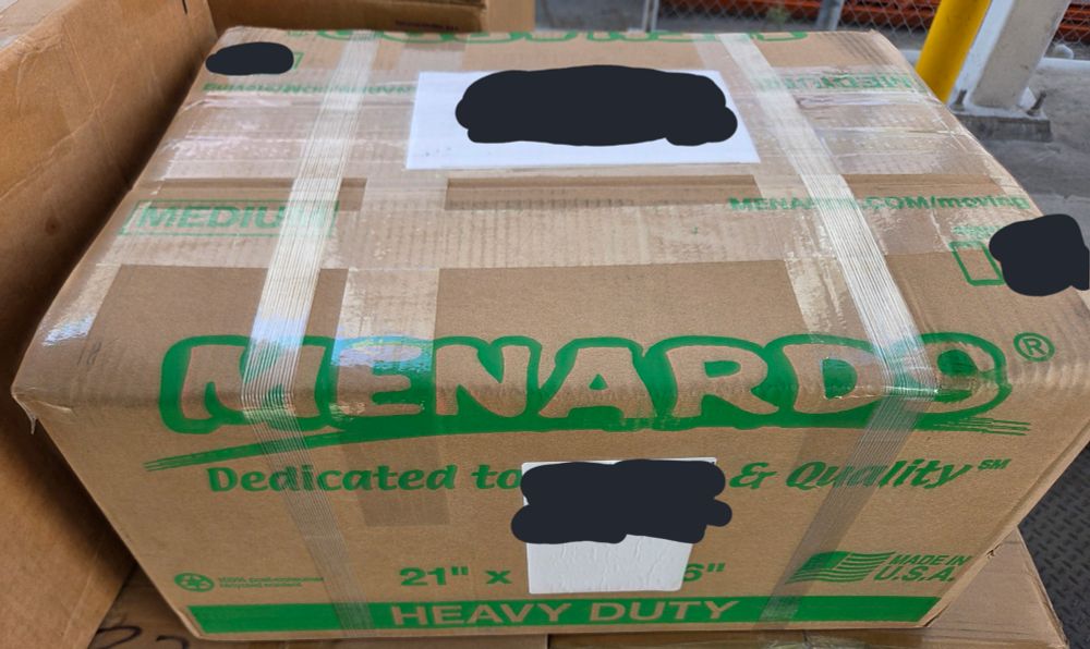 A cardboard box from a store called Menards