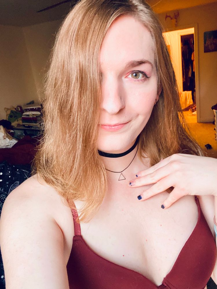 A similar photo to the last one but this time I have a wider smile and my hair is falling over one of my eyes