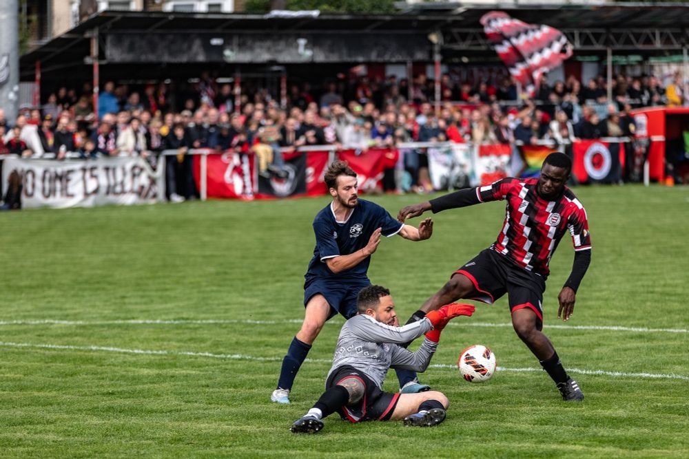 Match action with crowd in the background