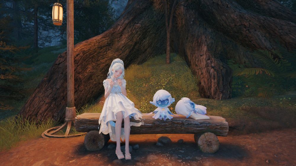 A woman in a white dress sat on a wooden bench next to a lamp post in the middle of the woods. Next to her on the bench are two faesprites which are little fairy type things dressed in blue and white 
