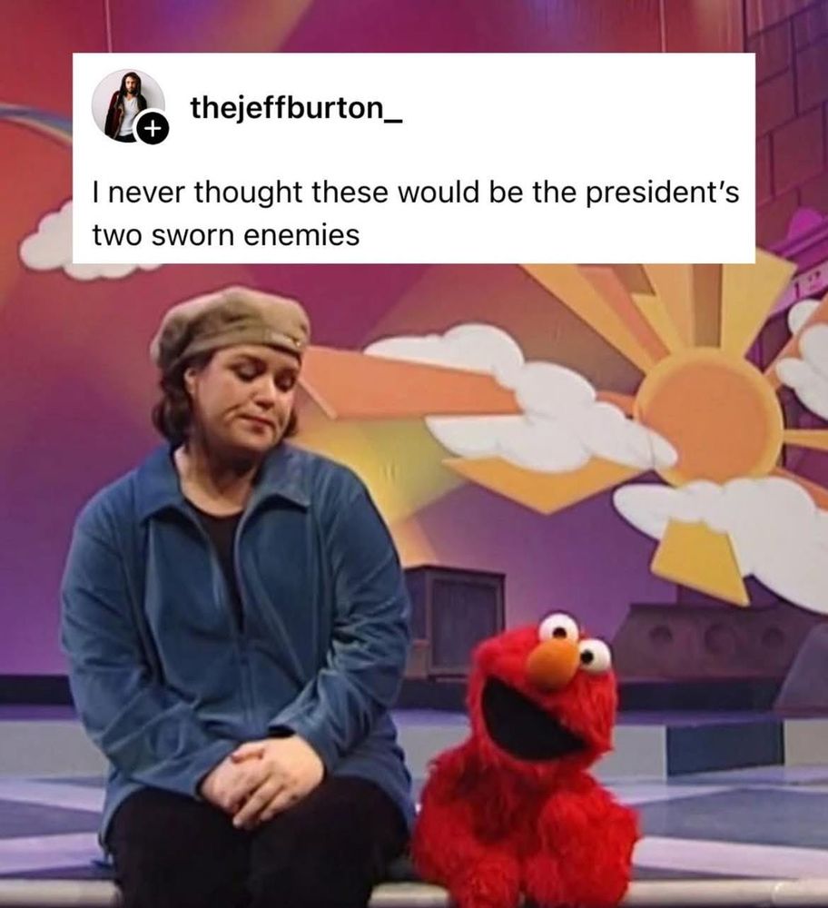 Rosie O’Donnell and Elmo from Sesame Street sit together on a colorful set. A caption above reads, I never thought these would be the president’s two sworn enemies.