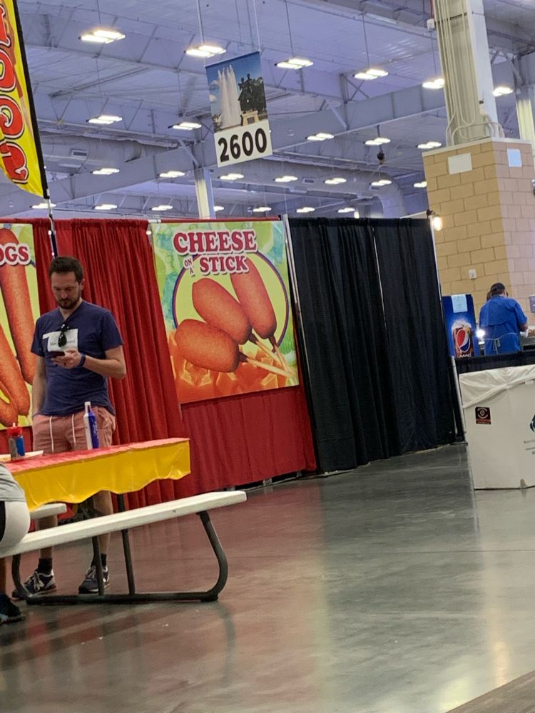 A photo of a sign advertising cheese on a stick