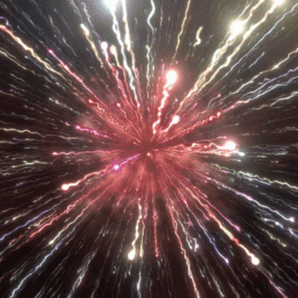 a fireworks display with red white and blue lights going off