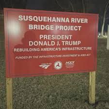 Susquehanna River bridge project sign with Donald Trump’s name taking credit for Biden program