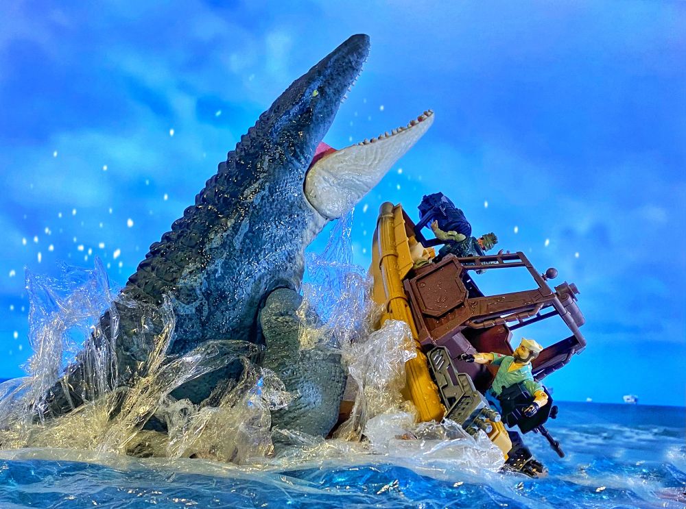 Mosasaurus arises from the ocean attacking a boat.