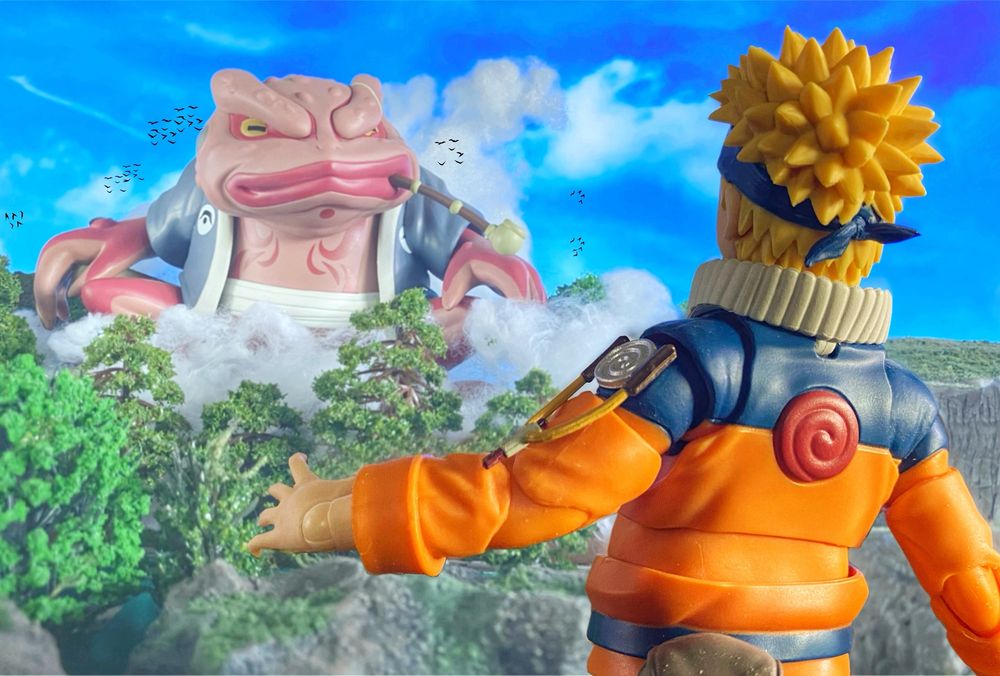 Giant frog appears in front of blond haired boy.