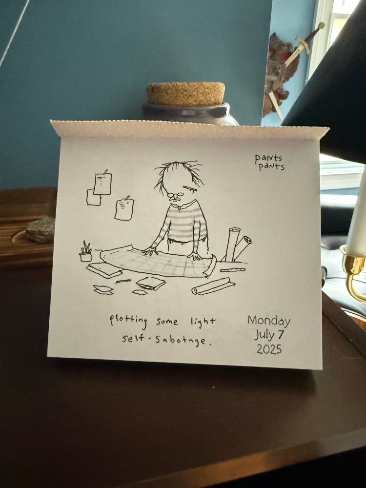 Pants pants comic daily calendar depicting someone with blueprints and the caption: “plotting some light self-sabotage”