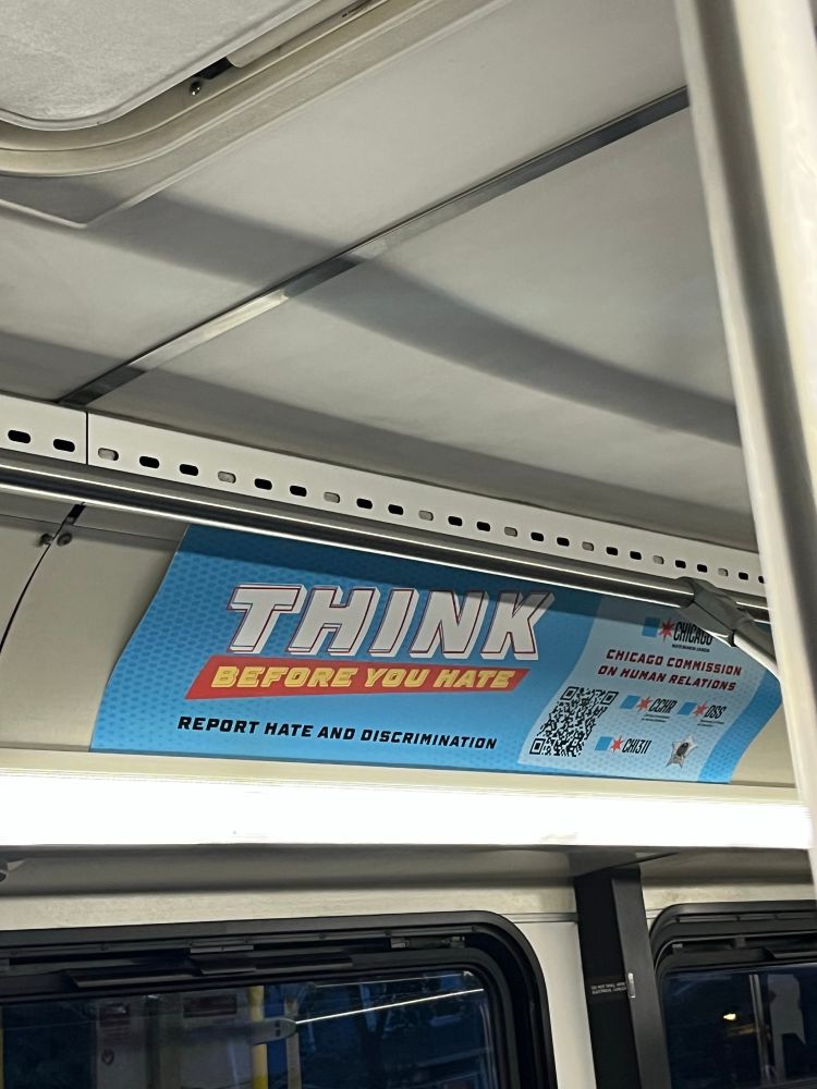 A bus ad that says “think before you hate”