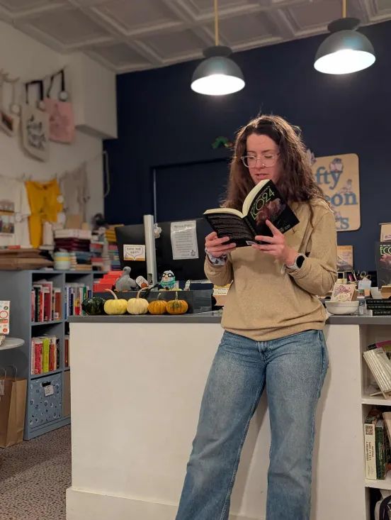 Author Kay Vaindal reading from their story "Pig House" (first published by Seize the Press magazine) in the ECO24 anthology