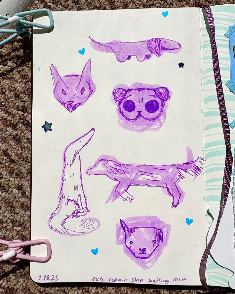 Journal page filled with cartoony purple marker sketches of different kinds of dogs.