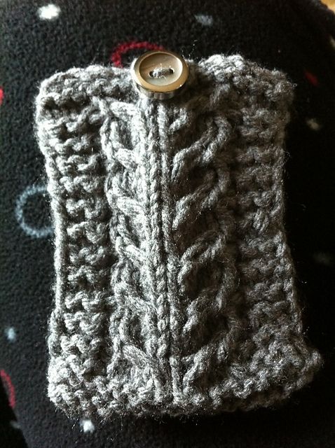 A small, grey gift card holder is edged with garter stitch, has a cable down the middle, and is closed with a small brown/ivory button at the top.
Pattern: Gift Card—igan by Julie Tarsha
Yarn:  random stashed grey acrylic