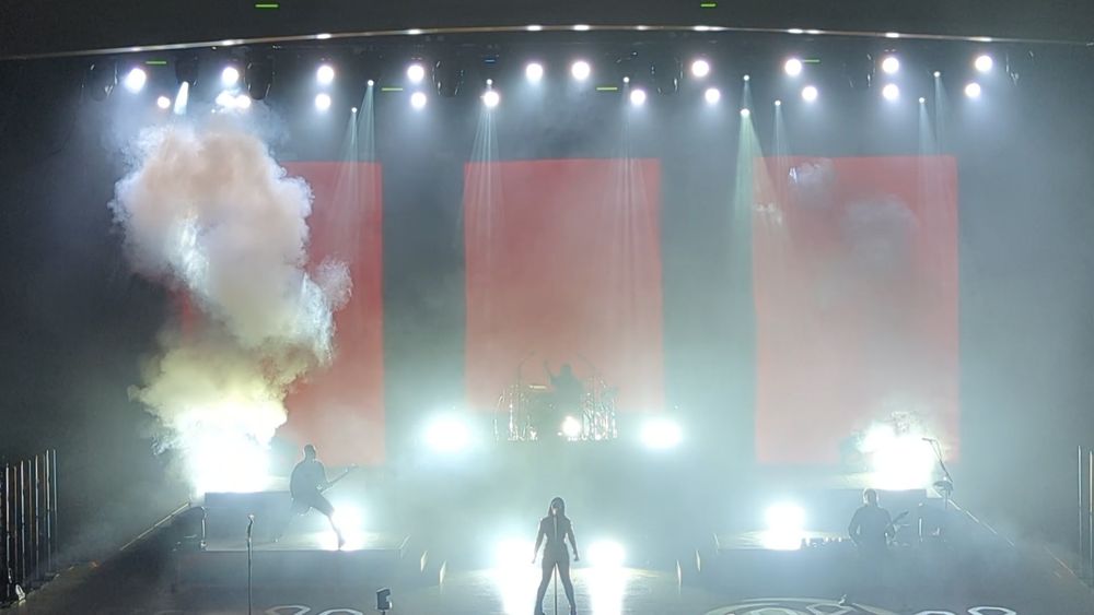Metal band Spiritbox on stage with smoke and bright lights