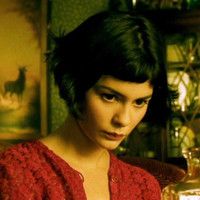 The titular character, Amélie Poulain, from the film Amelie. She has a cute, short-cut hairstyle and a red blouse.