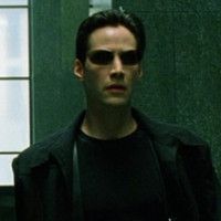 The character Neo from The Matrix, played by Keane Reeves. He has an all black outfit and sunglasses, and it absolutely slays. 