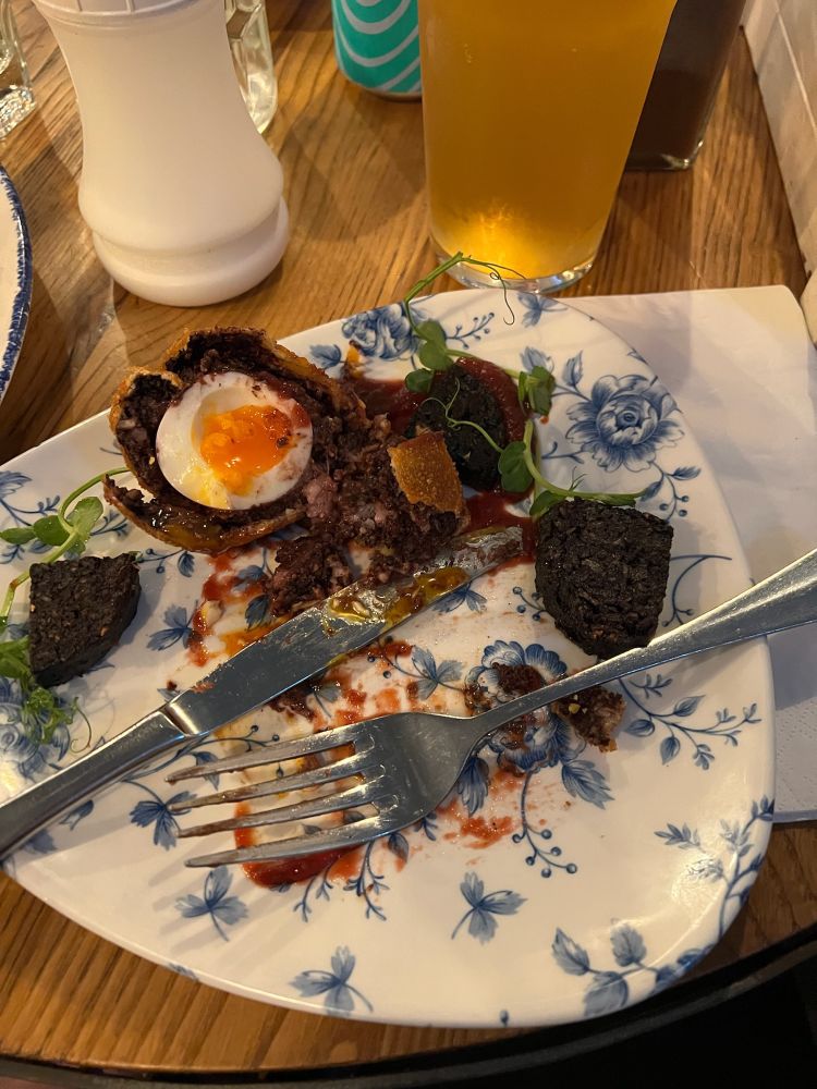 A plate of destroyed haggis scotch egg