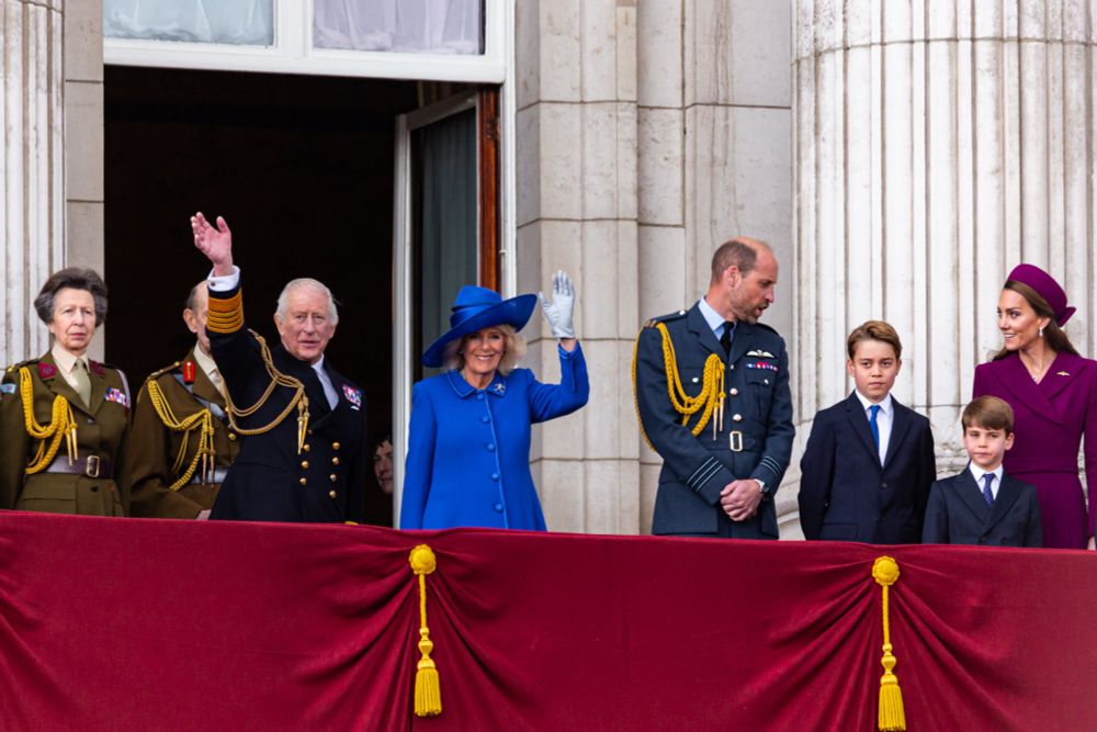 King Charles III, Queen Camilla, Prince William, Prince George, Catherine of Wales & Princess Royal on the balcony for VE Day anniversary celebrations.