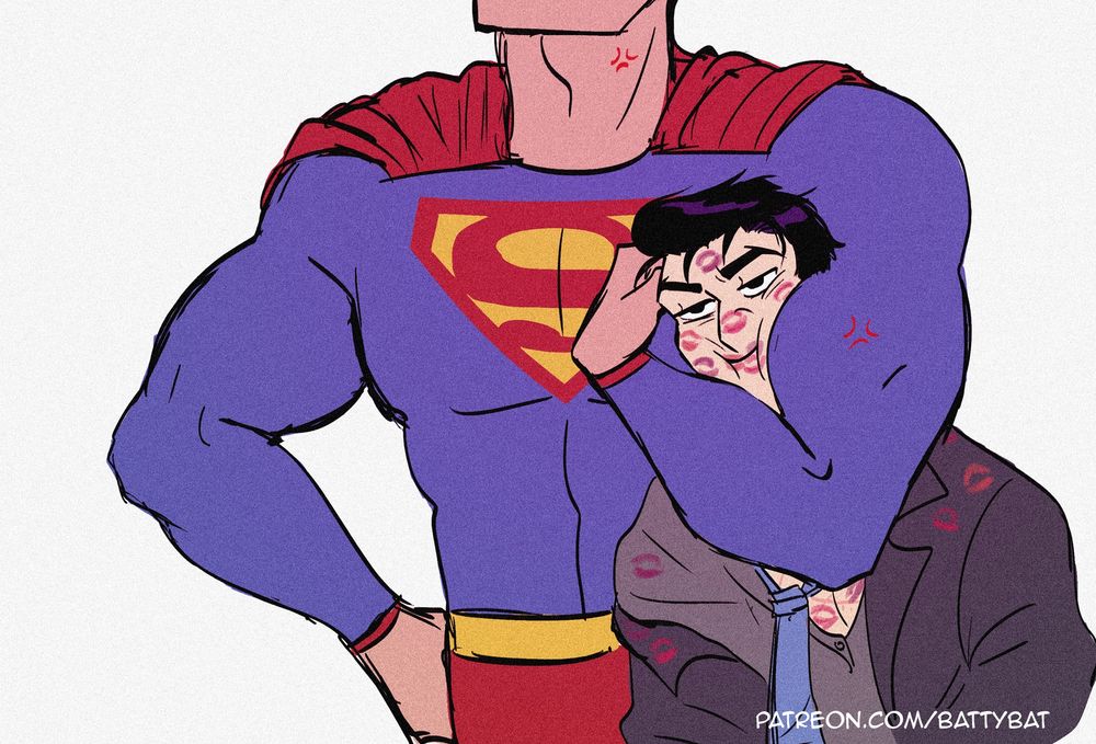 Bruce's face, covered in lipstick prints, is squeezed in between Superman's biceps.