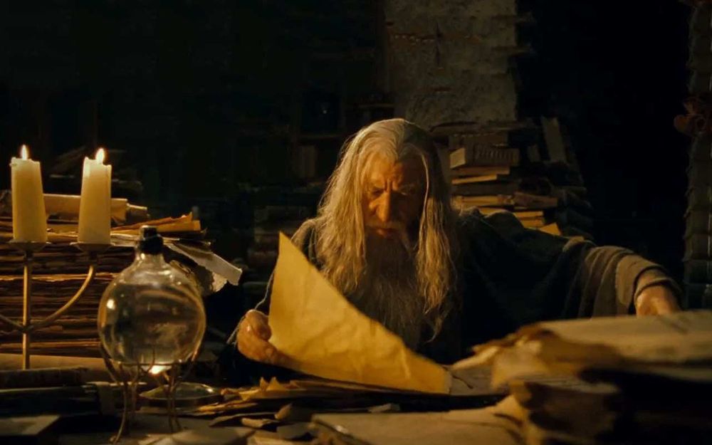 Gandalf the grey pouring over scrolls. 
