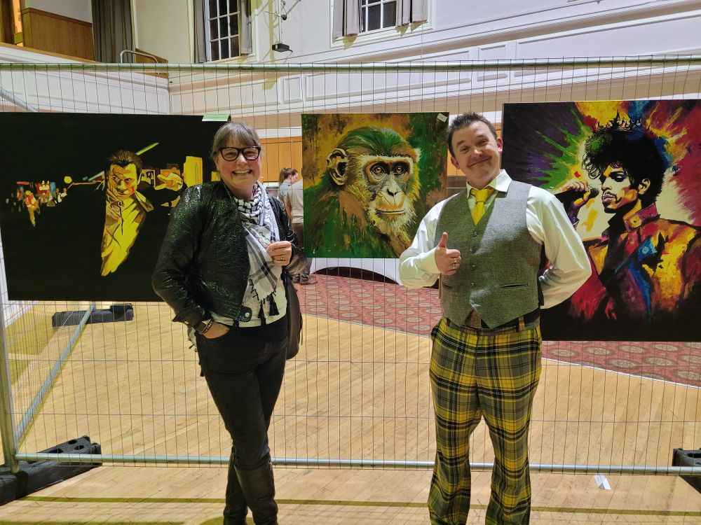 Lynne and Wee Scribbles in front of beautiful chimpanzee pic with the most soulful eyes