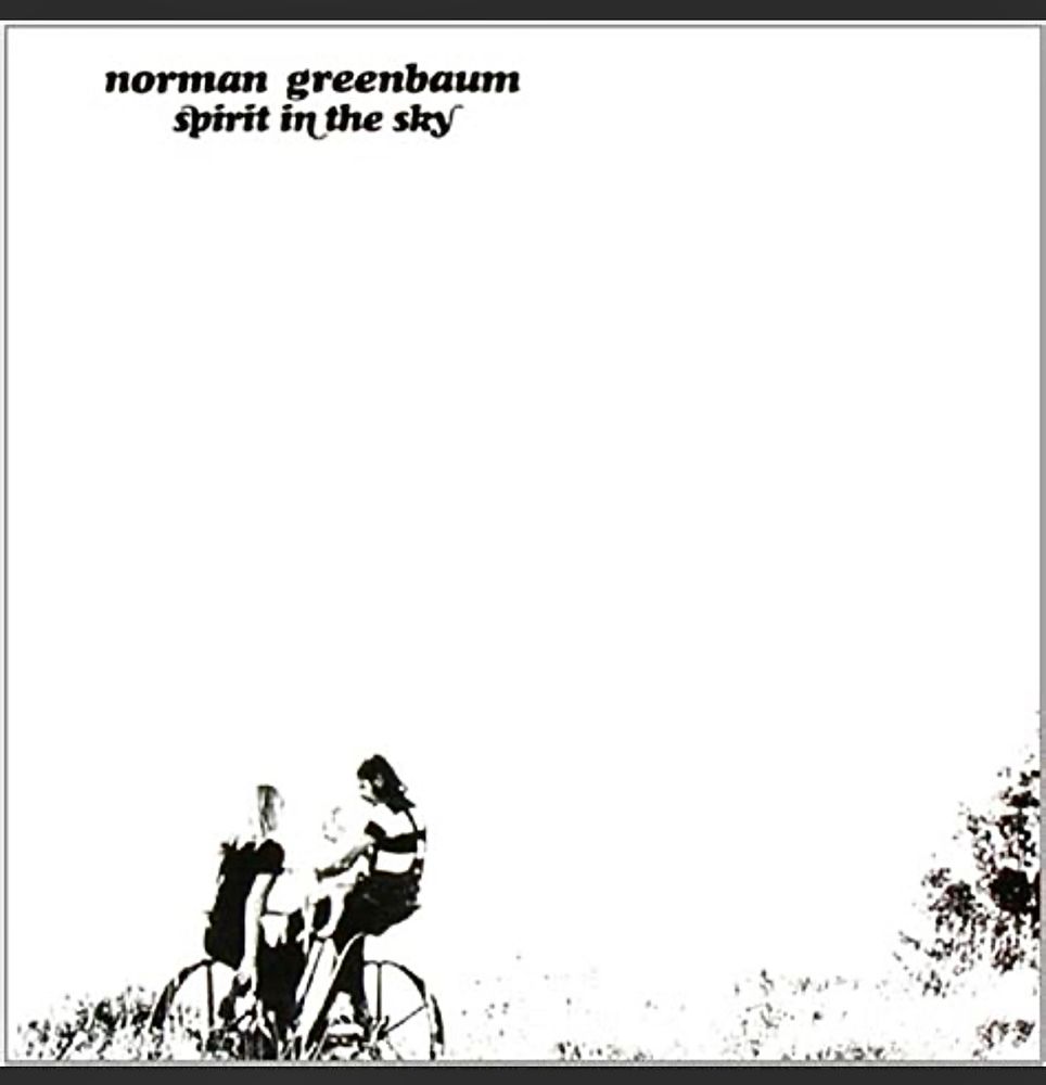 The image is a cover for "Spirit in the Sky" by Norman Greenbaum. The text "norman greenbaum" and "spirit in the sky" is positioned in the upper left corner. Below the text, there is a black and white illustration of two people sitting on a bicycle. The individuals are facing each other, with one person on the left and the other on the right. The bicycle is positioned at the bottom of the image, with the wheels visible. The background is predominantly white, with some texture or pattern visible in the lower right corner.
