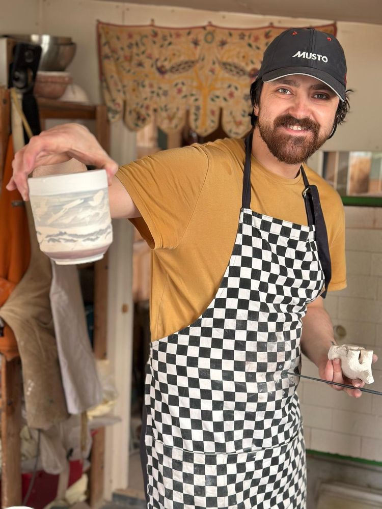A picture of the artist and his work.
