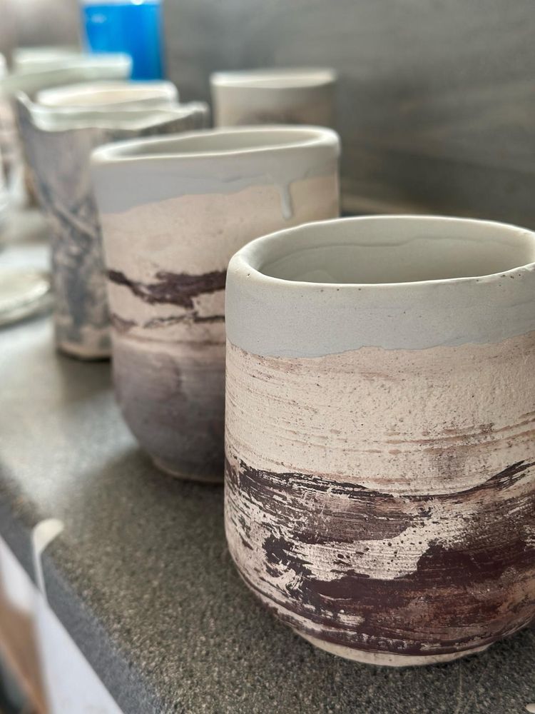 Decorated pots with glaze and oxides.
