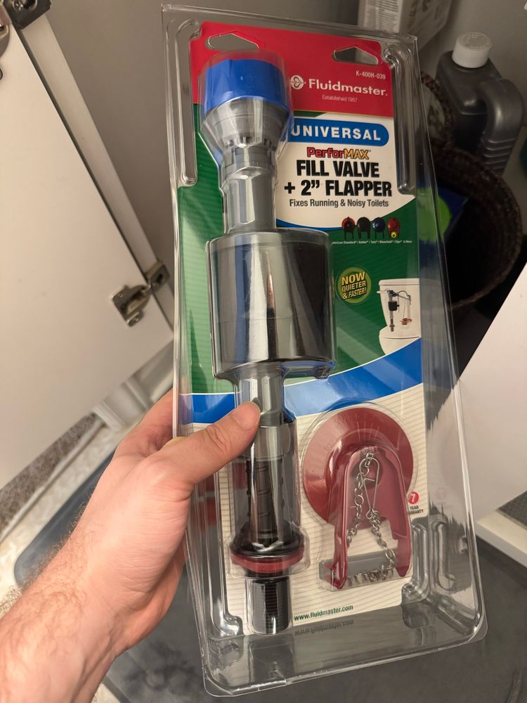A replacement fill valve kit for a toilet, which I am putting under the bathroom sink after having replaced one over the weekend.