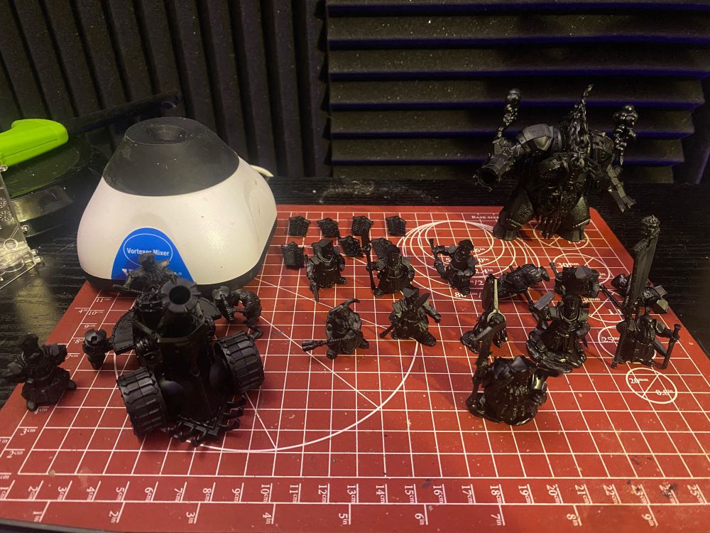 several plastic miniatures of Games Workshop's new Helsmiths of Hashut army.

and a small paint shaker.