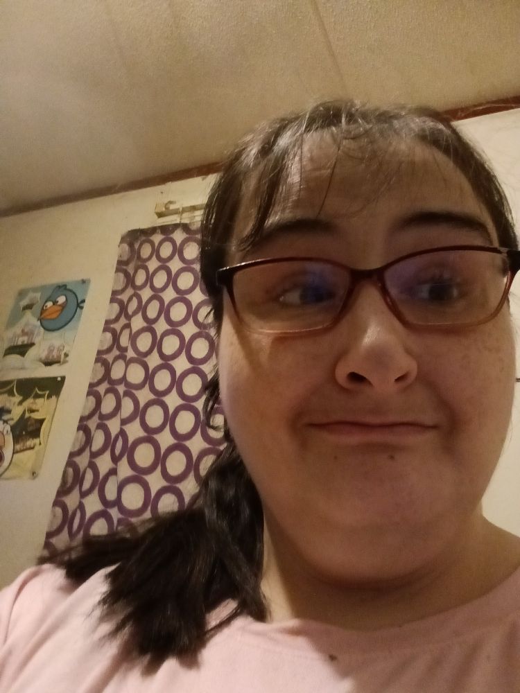 I chopped off half my ponytail.  It was a happy accident.  I only meant to chop off the ends. I can see my eyes!  There's no glare on my glasses either. I like this picture!