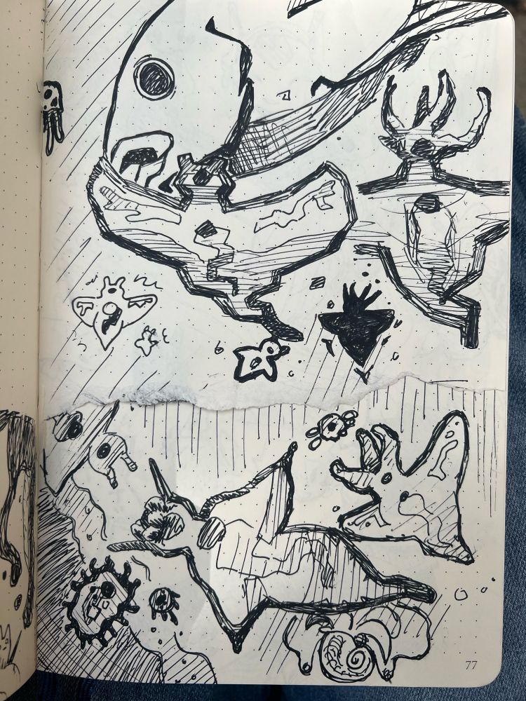 Pen sketches of sea life, fish, germs, and sea angels. 
