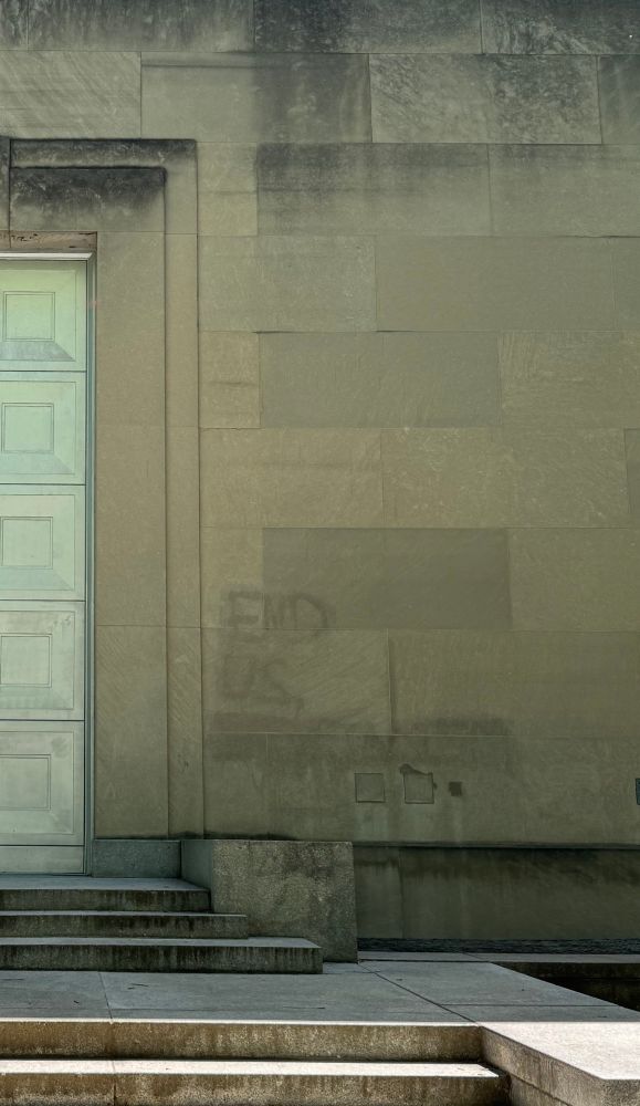 erased graffiti reading end u.s. imperialism 