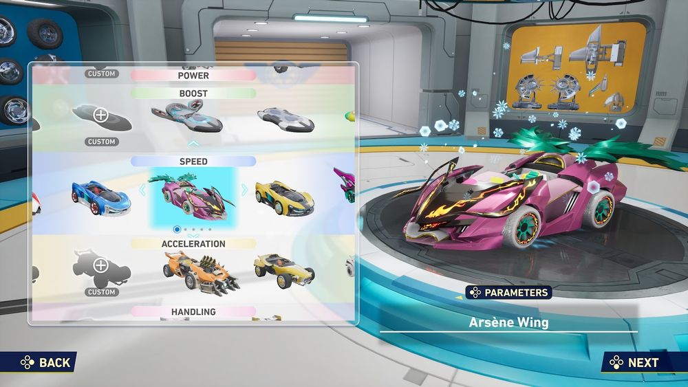 A machine selection showing different cars. The one selected is a pink car with a mask-like face in the front with horns. The fire-like design on the face are like eyes that goes reach to the horns and there's a fire-like design for the mouth. Behind the face, shown at a quarter angle are the hot pink heart and yellow diamond. The wheels are turquoise with a fire-like design and the tires are white. The seat is turquoise and light yellow. The wings in the back are turquoise too. The name of this car is Arsène Wing.