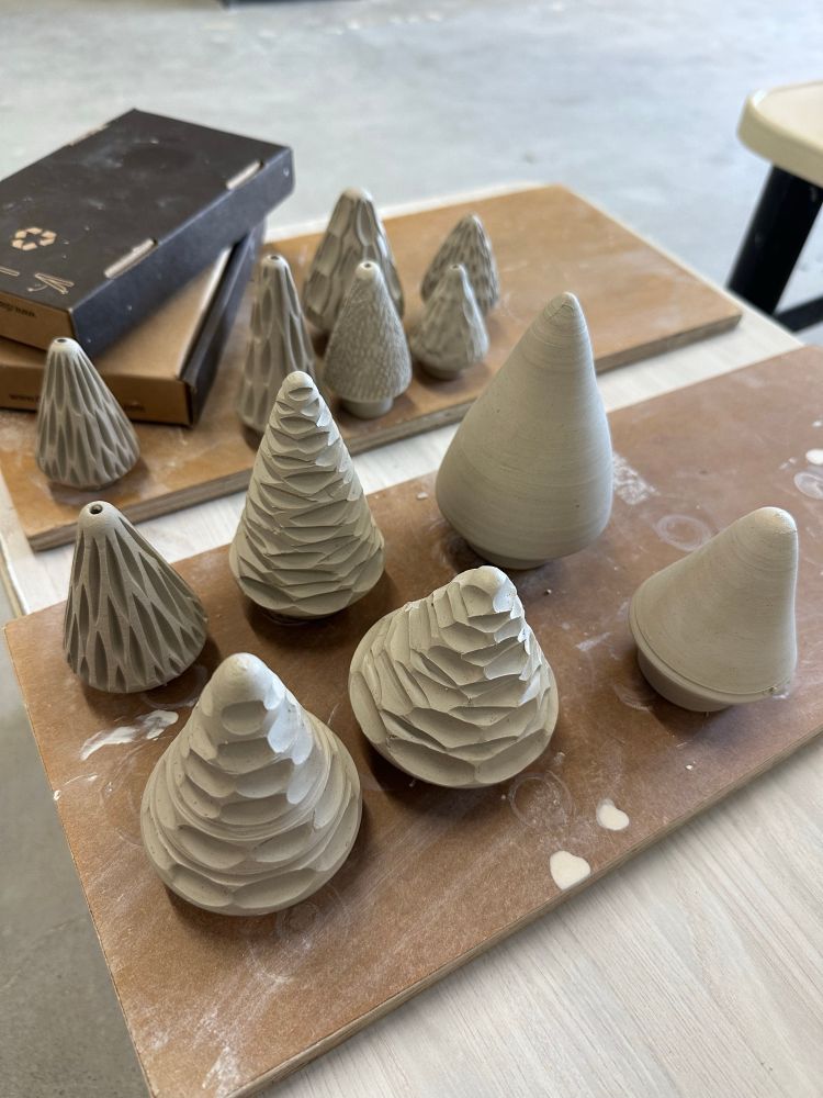 The same cones after trimming and carving. Some have little holes for hanging as ornaments on Christmas trees 