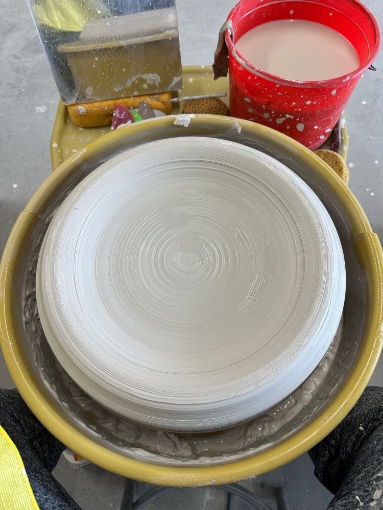 15 lbs of clay centered and flattened before shaping into a platter