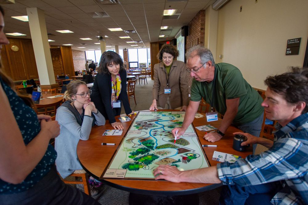 Maggie Karschnia guides Minnesota Sea Grant staff and advisory board members in playing the Watershed Game. Image credit: C. Dettmann/MNSG.