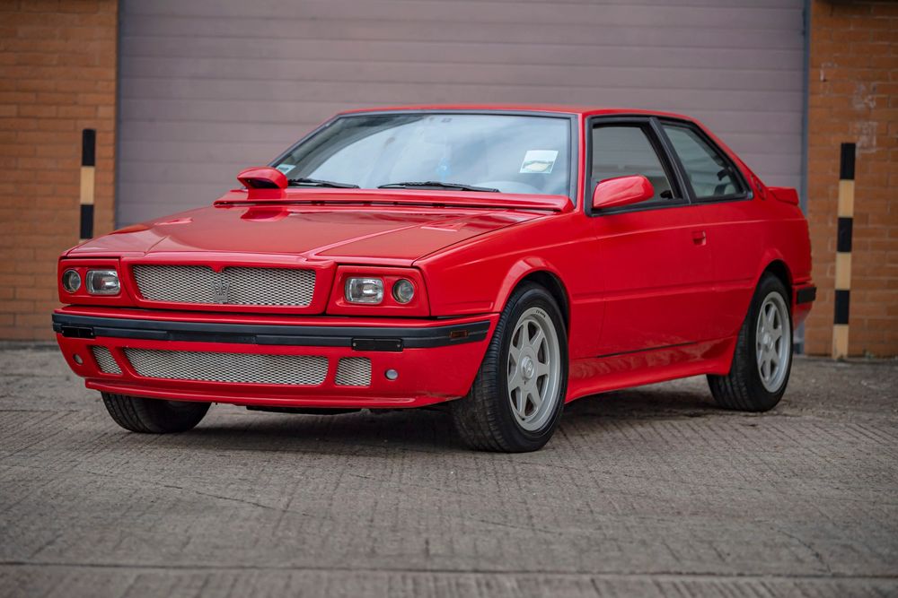 A very red Maserati Biturbo coupé car. Not my photo.