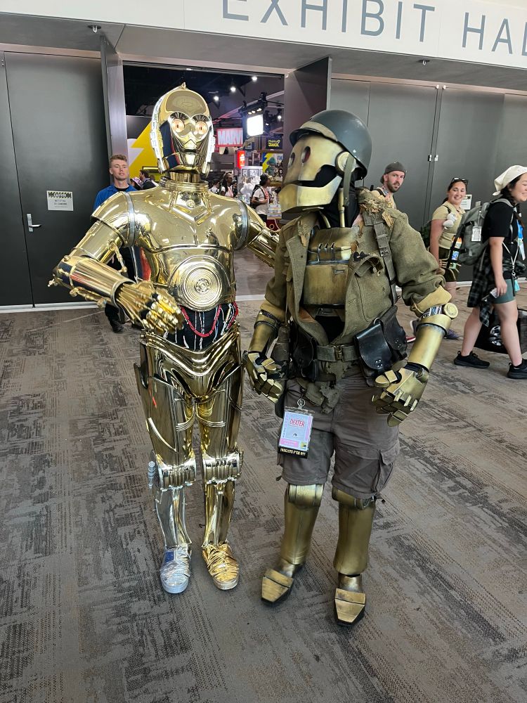 C-3po and GI Robot cosplays, plotting the downfall of fascists