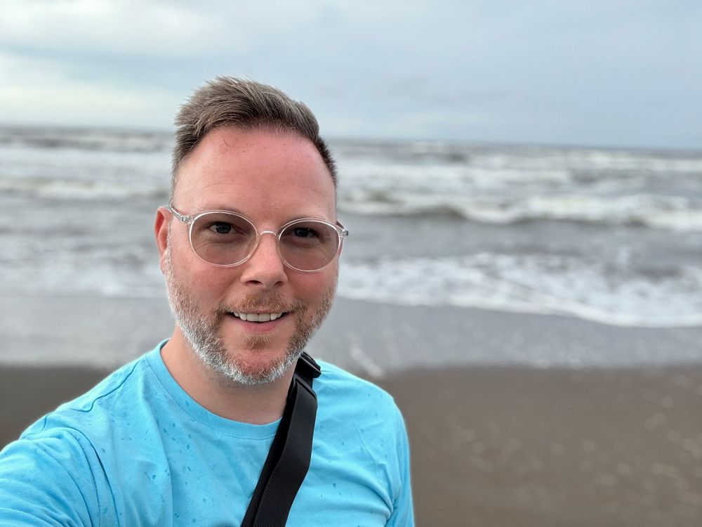 KP on the beach in Costa Rica. Waves in the background. 