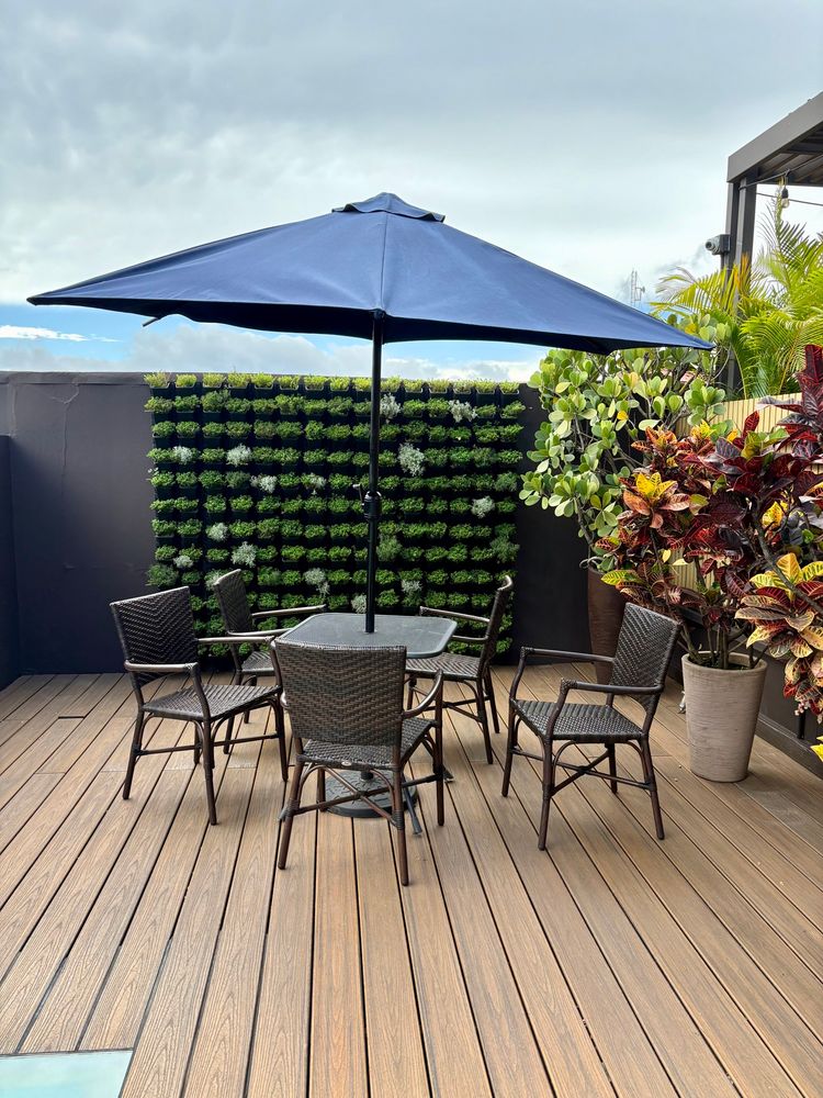Terrace chairs, table, and umbrella in San Jose, Costa Rica. 