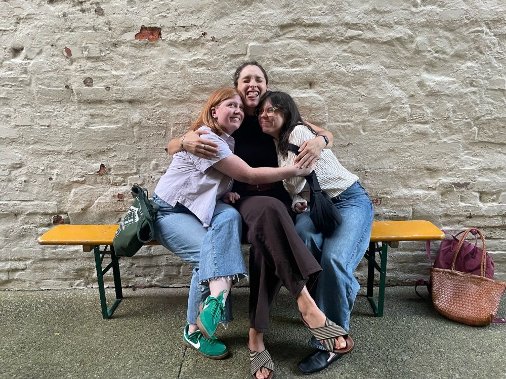 Kate, Katherine, and Meg hugging in Birmingham this weekend because they never see each other irl!