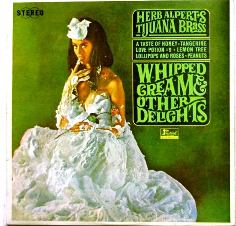 Cover of said album, green with a photo of a nice lady with brown hair, dressed in Whipped cream, putting her finger in her mouth to have a taste. All the dads had this! Rumor had it that it was shaving cream, though.