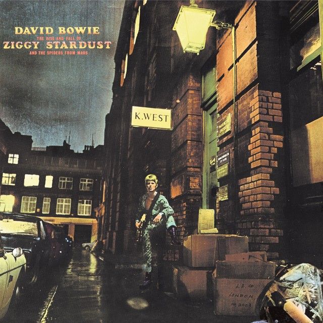 The album art for David Bowie's The Rise and Fall of Ziggy Stardust and the Spiders from Mars. Kind of a classical painting impression of some denim-wearing jackass just hanging out on a side street. Something alluring about it that you can't quite place, which is a pretty classic big boy Bowie appeal.