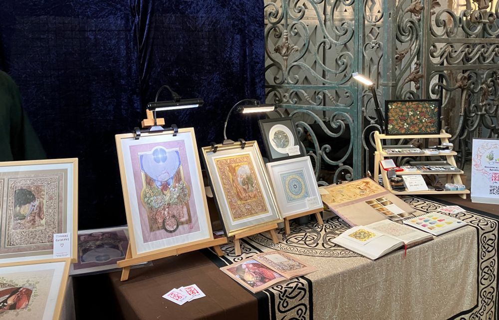 my table with a few paintings displayed