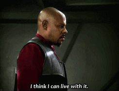 a bald man in a red shirt and black vest says i think i can live with it