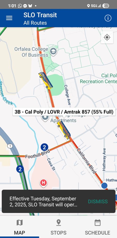 A screenshot of the SLO Transit app shows cute cartoon buses to indicate real-time bus locations, and each route is color-coded. The info gives the route number, the major endpoint names and connection to Amtrak, and percent fullness of the bus.