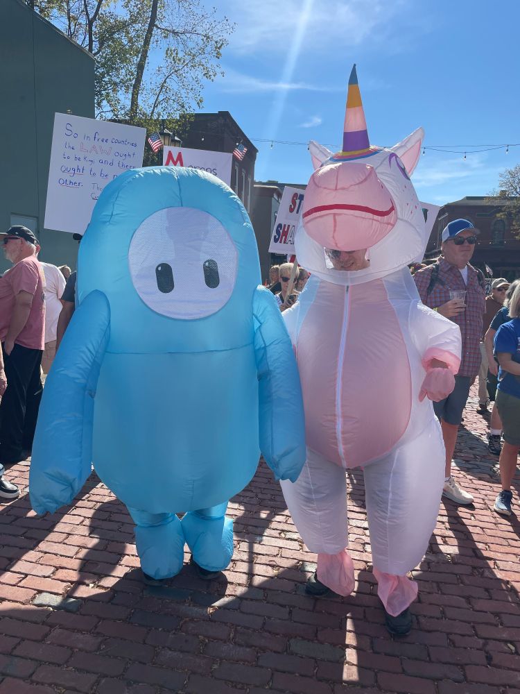 My kid and me in a bean and a unicorn inflatable costume, respectively.