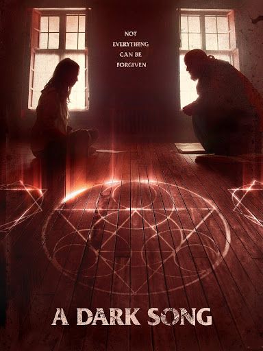 Poster for A Dark Song (2016). Poster shows a man and woman in a room with occult symbols on the floor.