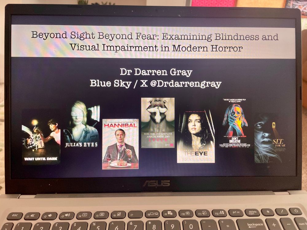 Laptop computer screen with a PPT with the title ‘Beyond Sight Beyond Fear: Examining Blindness and Visual Impairment in Modern Horror