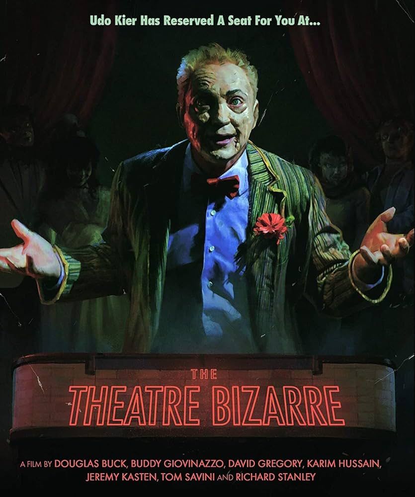 Poster for The Theatre Bizarre (2011). Poster shows Udo Kier in character as The Storyteller wearing a suit and a bow tie.
